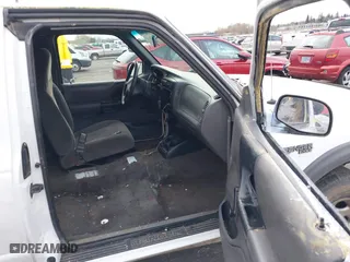 1999 Ford Ranger XLT with VIN 1FTZR15XXXTA09502, listed as a IAAI auction lot 41794904 with 203,276 mi miles. Bid and sale history available at carsss.com. Image 5.