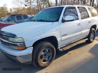 2003 Chevrolet Tahoe LT with VIN 1GNEC13Z63R103461, listed as a IAAI auction lot 41832198 with 289,031 mi miles. Bid and sale history available at carsss.com. Image 2.