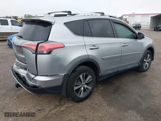 2016 Toyota RAV4 XLE with VIN 2T3WFREV5GW309468, listed as a IAAI auction lot 41973896 with 100,911 mi miles. Bid and sale history available at carsss.com. Image 4.