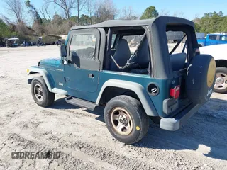 1997 Jeep Wrangler SE with VIN 1J4FY29P2VP492327, listed as a IAAI auction lot 41824808 with 156,646 mi miles. Bid and sale history available at carsss.com. Image 3.