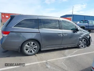 2014 Honda Odyssey Touring with VIN 5FNRL5H91EB093540, listed as a IAAI auction lot 41887412 with 202,076 mi miles and . Bid and sale history available at DreamBid. Image 13.