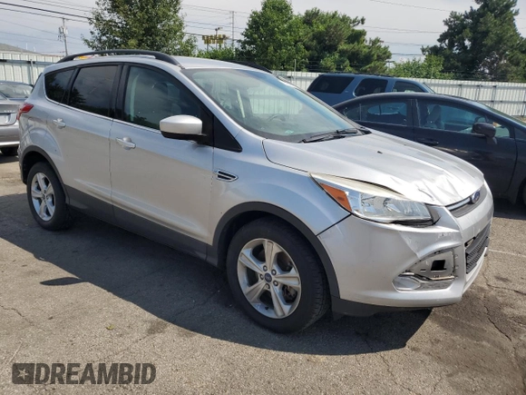 2014 Ford Escape SE with VIN 1FMCU9GX3EUB19987, listed as a Copart auction lot 64042695 with 96,775 mi miles and Salvage title. Bid and sale history available at DreamBid. Image 4.