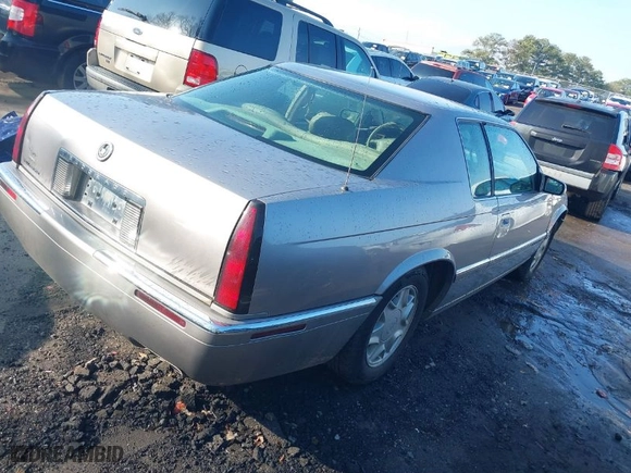 1997 Cadillac Eldorado with VIN 1G6EL12YXVU619391, listed as a IAAI auction lot 41462413 with 1 mi miles. Bid and sale history available at carsss.com. Image 4.