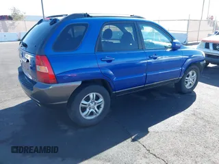 2005 Kia Sportage LX with VIN KNDJF723457057402, listed as a IAAI auction lot 41471742 with 215,565 mi miles and . Bid and sale history available at carsss.com. Image 4.