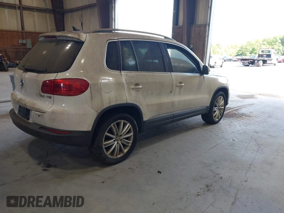 2012 Volkswagen Tiguan SE with VIN WVGAV7AXXCW533237, listed as a IAAI auction lot 42670923 with 227,323 mi miles and . Bid and sale history available at DreamBid. Image 4.
