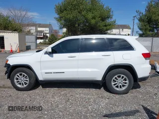 2018 Jeep Grand Cherokee Laredo E with VIN 1C4RJEAG3JC300760, listed as a IAAI auction lot 41811734 with 131,406 mi miles. Bid and sale history available at carsss.com. Image 14.