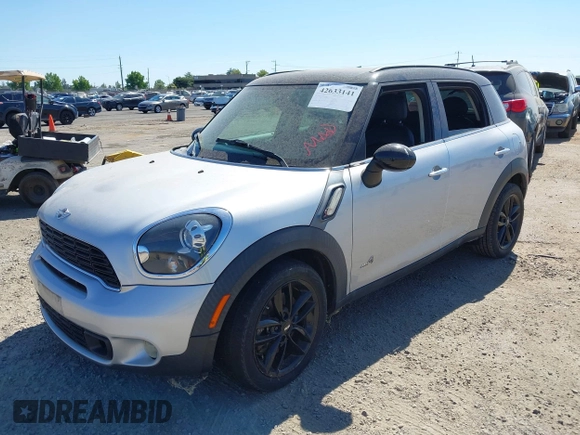 2014 MINI Countryman S with VIN WMWZC5C54EWP40882, listed as a IAAI auction lot 42633141 with 176,641 mi miles and . Bid and sale history available at DreamBid. Image 2.