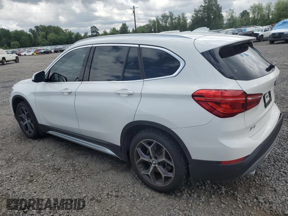 2018 BMW X1 xDrive28i with VIN WBXHT3C35J5L29298, listed as a Copart auction lot 59041435 with 27,612 mi miles and Salvage title. Bid and sale history available at DreamBid. Image 2.