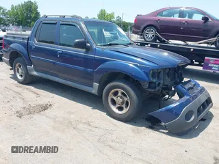 2004 Ford Explorer Sport Trac XLS z VIN 1FMZU77K04UB58957, wystawiony jako IAAI lot #42390881 z przebiegiem 262 140 mil mil oraz . Historia ofert i sprzedaży dostępna na DreamBid. Obrazek 1.