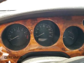 1999 Jaguar XK z VIN SAJGX2049XC034022, wystawiony jako Copart lot #55690025 z przebiegiem Nie podano mil oraz Tytuł czysty. Historia ofert i sprzedaży dostępna na DreamBid. Obrazek 9.
