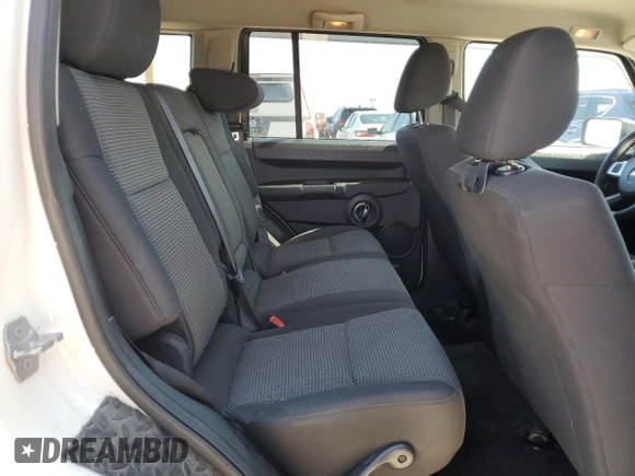 2010 Jeep Commander Sport with VIN 1J4RG4GKXAC121954, listed as a Copart auction lot 51965925 with 144,115 mi miles and Salvage title. Bid and sale history available at DreamBid. Image 11.