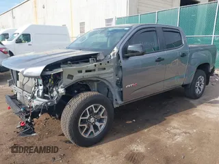 2022 GMC Canyon 4WD AT4 z VIN 1GTG6FEN2N1101756, wystawiony jako IAAI lot #42107148 z przebiegiem 37 900 mil mil oraz . Historia ofert i sprzedaży dostępna na DreamBid. Obrazek 2.