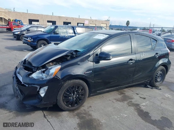2015 Toyota Prius c One with VIN JTDKDTB3XF1585940, listed as a IAAI auction lot 41263863 with 267,841 mi miles. Bid and sale history available at carsss.com. Image 2.