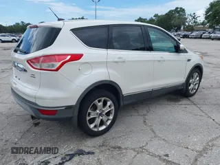 2013 Ford Escape SEL z VIN 1FMCU9HX5DUC33079, wystawiony jako IAAI lot #42521744 z przebiegiem 133 864 mil mil oraz . Historia ofert i sprzedaży dostępna na DreamBid. Obrazek 4.