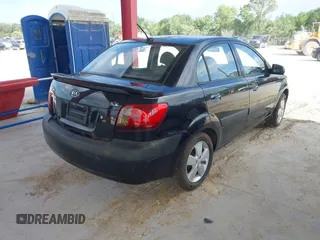 2009 Kia Rio LX with VIN KNADE223496561265, listed as a IAAI auction lot 42143889 with 235,634 mi miles and . Bid and sale history available at DreamBid. Image 4.