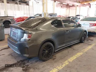 2014 Scion tC with VIN JTKJF5C77E3069906, listed as a IAAI auction lot 41243445 with 128,791 mi miles. Bid and sale history available at carsss.com. Image 4.