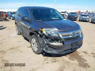 2019 Honda Pilot LX with VIN 5FNYF5H1XKB033524, listed as a IAAI auction lot 41613697 with 105,744 mi miles. Bid and sale history available at carsss.com. Image 1.