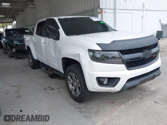 2020 Chevrolet Colorado 2WD Z71 with VIN 1GCGSDEN2L1159458, listed as a IAAI auction lot 42412924 with 90,011 mi miles and . Bid and sale history available at DreamBid. Image 1.