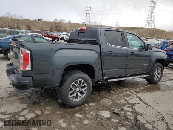 2018 GMC Canyon z VIN 1GTP6CE1XJ1173875, wystawiony jako Copart lot #47258005 z przebiegiem 104 076 mil mil oraz Szkoda całkowita • Salvage title. Historia ofert i sprzedaży dostępna na DreamBid. Obrazek 3.
