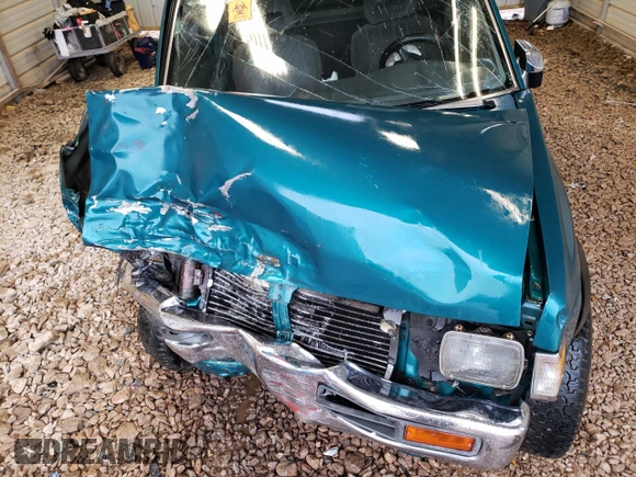1997 Nissan Frontier XE with VIN 1N6SD16Y2VC338776, listed as a Copart auction lot 45020595 with 243,030 mi miles and Salvage title. Bid and sale history available at DreamBid. Image 12.