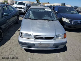 1995 Toyota Tercel DX with VIN JT2EL56E7S7011335, listed as a Copart auction lot 67978774 with 182,025 mi miles and Salvage Title. Bid and sale history available at carsss.com. Image 5.