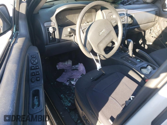 2003 Jeep Grand Cherokee Laredo with VIN 1J4GX48S63C523513, listed as a Copart auction lot 50001005 with 0 mi miles and Salvage Title. Bid and sale history available at carsss.com. Image 8.