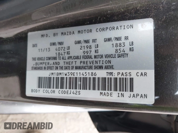 2014 Mazda 3 S Grand Touring with VIN JM1BM1W39E1145186, listed as a IAAI auction lot 41948404 with 111,702 mi miles and . Bid and sale history available at DreamBid. Image 9.