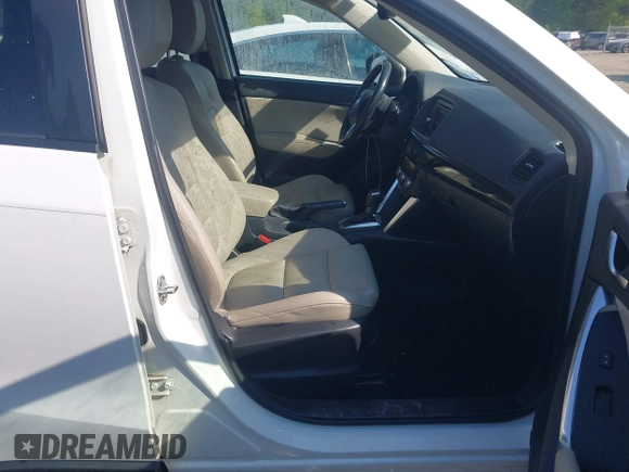 2014 Mazda CX-5 Grand Touring with VIN JM3KE2DY1E0424890, listed as a IAAI auction lot 42052437 with 107,793 mi miles. Bid and sale history available at carsss.com. Image 5.