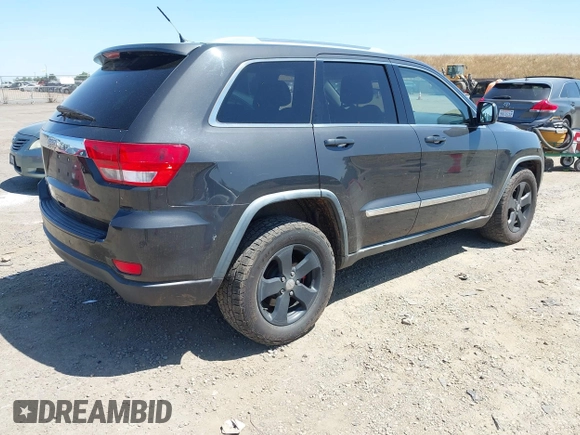 2011 Jeep Grand Cherokee Laredo with VIN 1J4RR4GG7BC715778, listed as a IAAI auction lot 42313636 with 249,209 mi miles and . Bid and sale history available at DreamBid. Image 4.