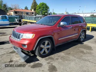 2011 Jeep Grand Cherokee Overland with VIN 1J4RR6GT8BC606688, listed as a Copart auction lot 57182295 with 100,423 mi miles and Salvage title. Bid and sale history available at DreamBid. Image 1.