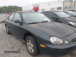 1999 Ford Taurus SE z VIN 1FAFP53U2XA116215, wystawiony jako IAAI lot #42210161 z przebiegiem 260 212 mil mil oraz . Historia ofert i sprzedaży dostępna na DreamBid. Obrazek 1.