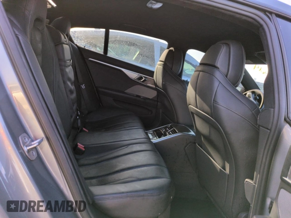 2023 BMW 8 Series M850i z VIN WBAGV8C02PCL20503, wystawiony jako Copart lot #74098614 z przebiegiem Nie podano mil oraz Szkoda całkowita • Salvage title. Historia ofert i sprzedaży dostępna na DreamBid. Obrazek 10.