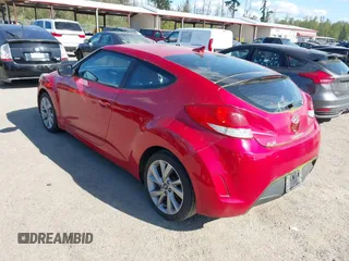 2016 Hyundai Veloster with VIN KMHTC6AD2GU284741, listed as a IAAI auction lot 42108919 with 162,616 mi miles. Bid and sale history available at carsss.com. Image 3.