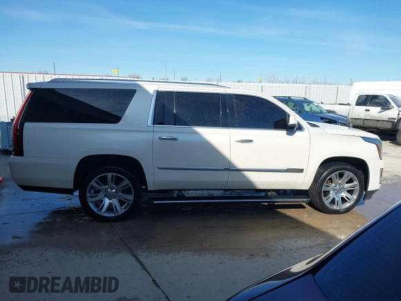 2015 Cadillac Escalade ESV Premium z VIN 1GYS4TKJ9FR700022, wystawiony jako IAAI lot #41748188 z przebiegiem 166 416 mil mil oraz . Historia ofert i sprzedaży dostępna na DreamBid. Obrazek 13.