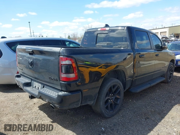 2023 Ram 1500 Laramie with VIN 1C6SRFJT6PN542105, listed as a IAAI auction lot 41974428 with 74,489 mi miles and . Bid and sale history available at DreamBid. Image 4.