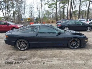 1995 Ford Probe z VIN 1ZVLT22B1S5104093, wystawiony jako IAAI lot #41744654 z przebiegiem 166 253 mil mil oraz . Historia ofert i sprzedaży dostępna na DreamBid. Obrazek 13.