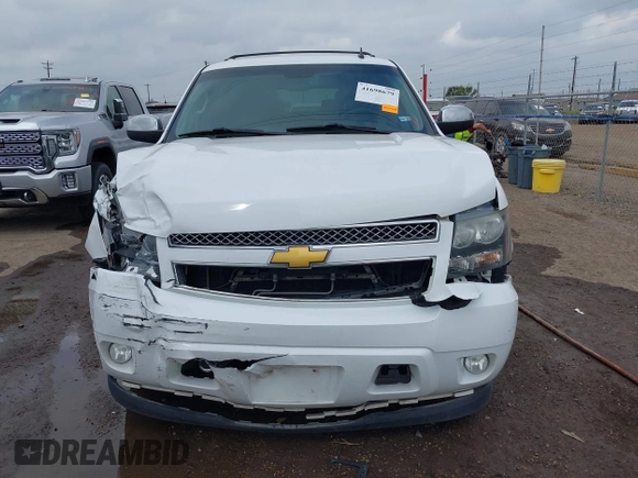2014 Chevrolet Suburban LT with VIN 1GNSCJE04ER107836, listed as a IAAI auction lot 41698679 with 106,139 mi miles. Bid and sale history available at carsss.com. Image 12.