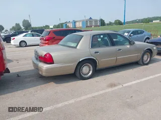 2000 Mercury Grand Marquis LS z VIN 2MEFM75W7YX729323, wystawiony jako IAAI lot #42475457 z przebiegiem 148 910 mil mil oraz . Historia ofert i sprzedaży dostępna na DreamBid. Obrazek 4.