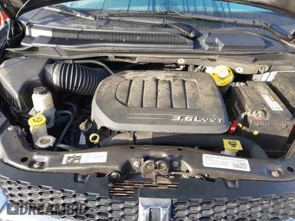 2014 Dodge Grand Caravan SXT with VIN 2C4RDGCG2ER267358, listed as a IAAI auction lot 41001692 with 186,763 mi miles and . Bid and sale history available at DreamBid. Image 10.
