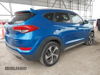 2018 Hyundai Tucson Sport with VIN KM8J33AL0JU803368, listed as a IAAI auction lot 41937235 with 64,163 mi miles and . Bid and sale history available at DreamBid. Image 4.