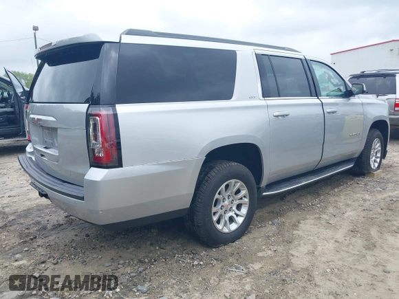 2019 GMC Yukon XL SLT z VIN 1GKS1GKC0KR242408, wystawiony jako IAAI lot #42144783 z przebiegiem Nie podano mil oraz . Historia ofert i sprzedaży dostępna na DreamBid. Obrazek 4.