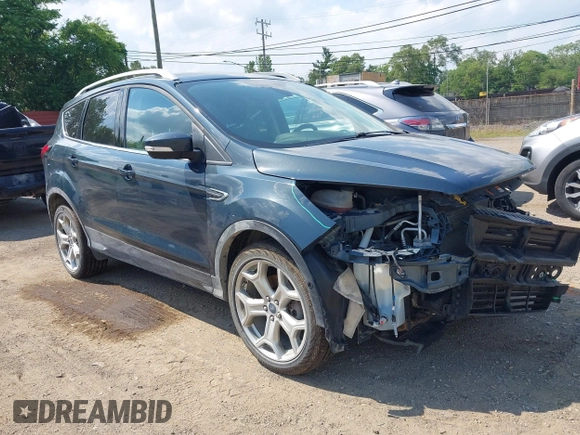 2019 Ford Escape Titanium with VIN 1FMCU9J99KUC00935, listed as a IAAI auction lot 42583250 with 91,241 mi miles and . Bid and sale history available at DreamBid. Image 1.