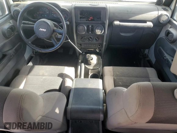 2007 Jeep Wrangler Unlimited X with VIN 1J8GB39157L142982, listed as a Copart auction lot 82050134 with 72,666 mi miles and Salvage Title. Bid and sale history available at DreamBid. Image 8.