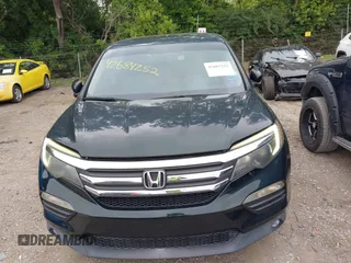 2016 Honda Pilot EX-L with VIN 5FNYF6H59GB100369, listed as a IAAI auction lot 42684252 with 146,609 mi miles and . Bid and sale history available at DreamBid. Image 6.