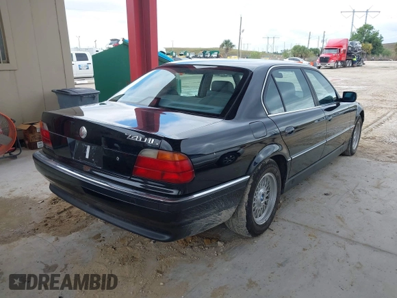 1997 BMW 7 Series 740il with VIN WBAGJ8324VDL43320, listed as a IAAI auction lot 41990660 with 193,998 mi miles. Bid and sale history available at carsss.com. Image 4.