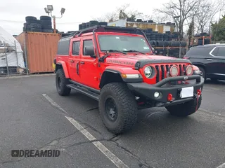 2020 Jeep Gladiator Rubicon with VIN 1C6JJTBGXLL113994, listed as a IAAI auction lot 41827617 with 32,186 mi miles and . Bid and sale history available at DreamBid. Image 1.