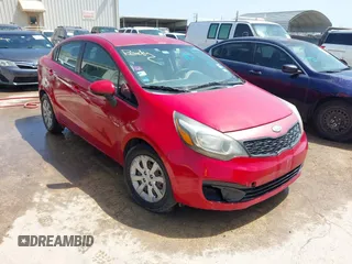 2012 Kia Rio LX with VIN KNADM4A36C6085057, listed as a IAAI auction lot 42111921 with 136,217 mi miles. Bid and sale history available at carsss.com. Image 1.