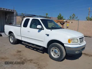 2001 Ford F-150 XL with VIN 1FTRX18L11NA74152, listed as a IAAI auction lot 42705617 with 186,281 mi miles and . Bid and sale history available at DreamBid. Image 1.