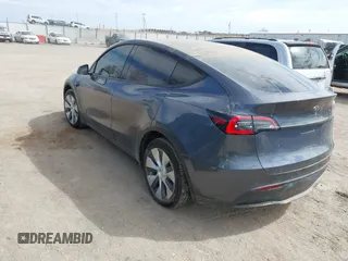 2022 Tesla Model Y Long Range with VIN 7SAYGDEE5NF534259, listed as a IAAI auction lot 41860246 with 24,513 mi miles and . Bid and sale history available at carsss.com. Image 3.