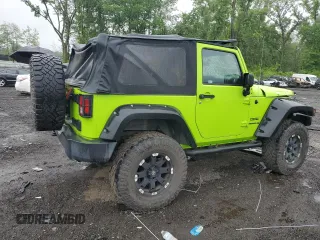 2012 Jeep Wrangler Sport with VIN 1C4AJWAG2CL233722, listed as a Copart auction lot 61125095 with 49,864 mi miles and Salvage title. Bid and sale history available at DreamBid. Image 3.